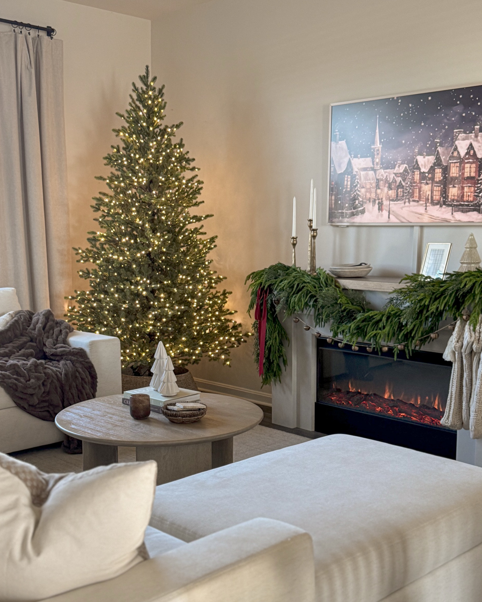 Christmas living room decor, holiday decor, Christmas decor, Christmas tree, twinkle lights, cozy living room, fireplace, garland, round coffee table 

#LTKHome #LTKSeasonal #LTKHoliday