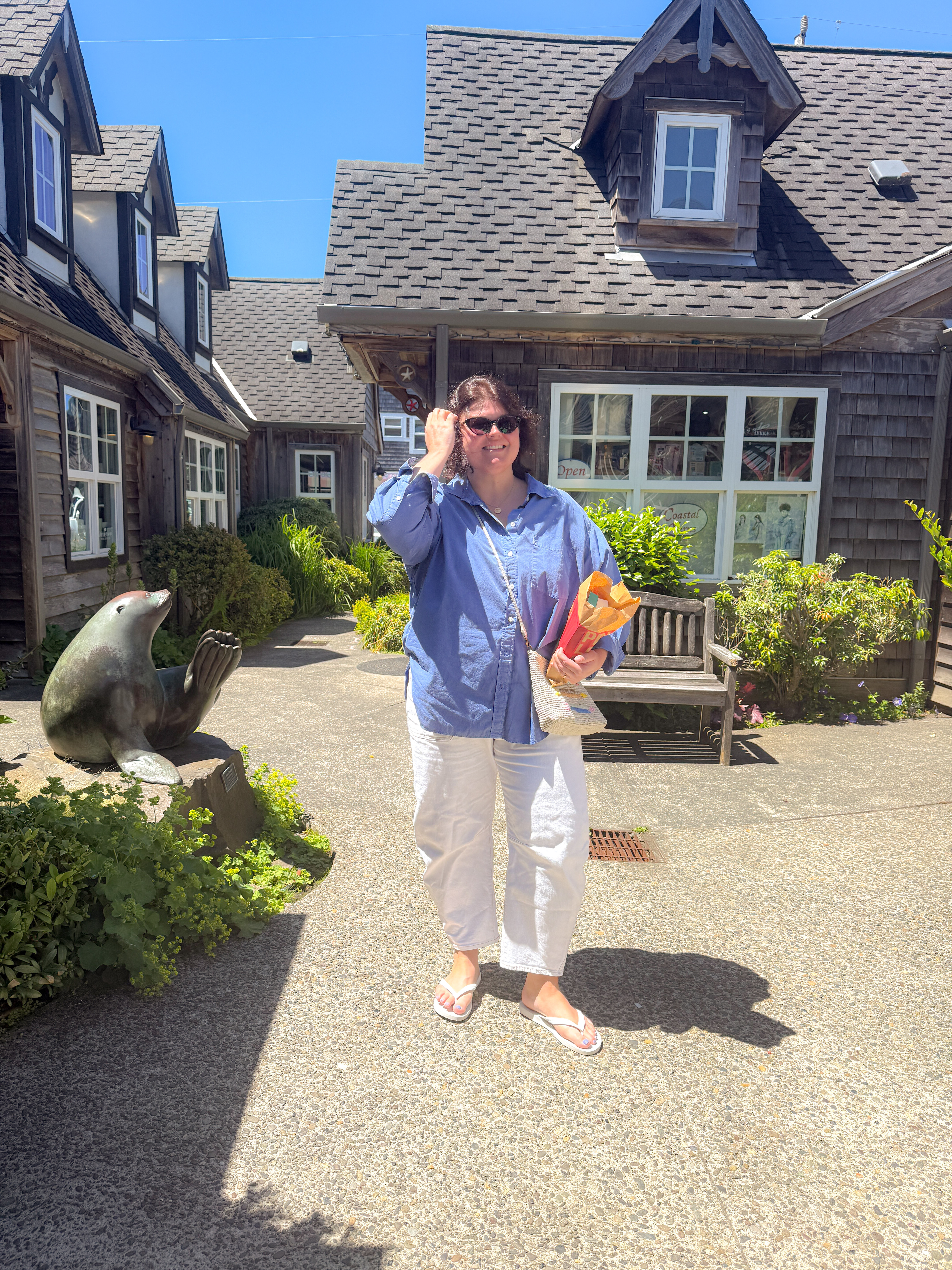 This oversized button-down works as a top, a cover-up, and a layer, today it's all three. Paired with the same cream wide-leg pants from earlier (officially a vacation staple at this point) and flip-flops for a full afternoon of beach-town wandering. Taffy stop: non-negotiable.
Hashtags

#LTKtravel #LTKitbag #LTKfindsunder50 #oregoncoast #cannonbeach #beachtownstyle #vacationoutfit #oversizedshirt #widelegpants #coastalstyle 

 