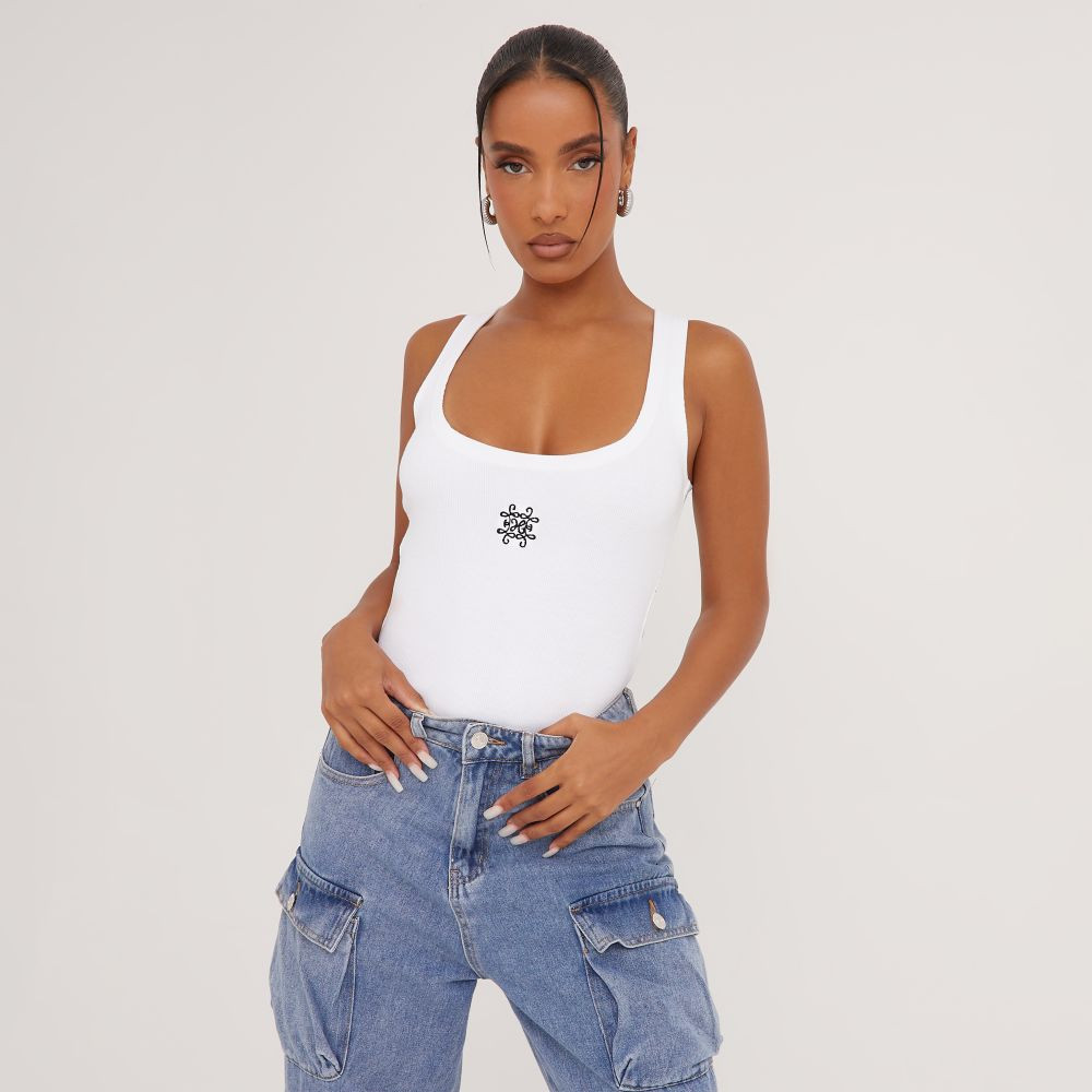 Low Scoop Neck Swirl Graphic Print Logo Vest In White Ribbed | EGO (UK)