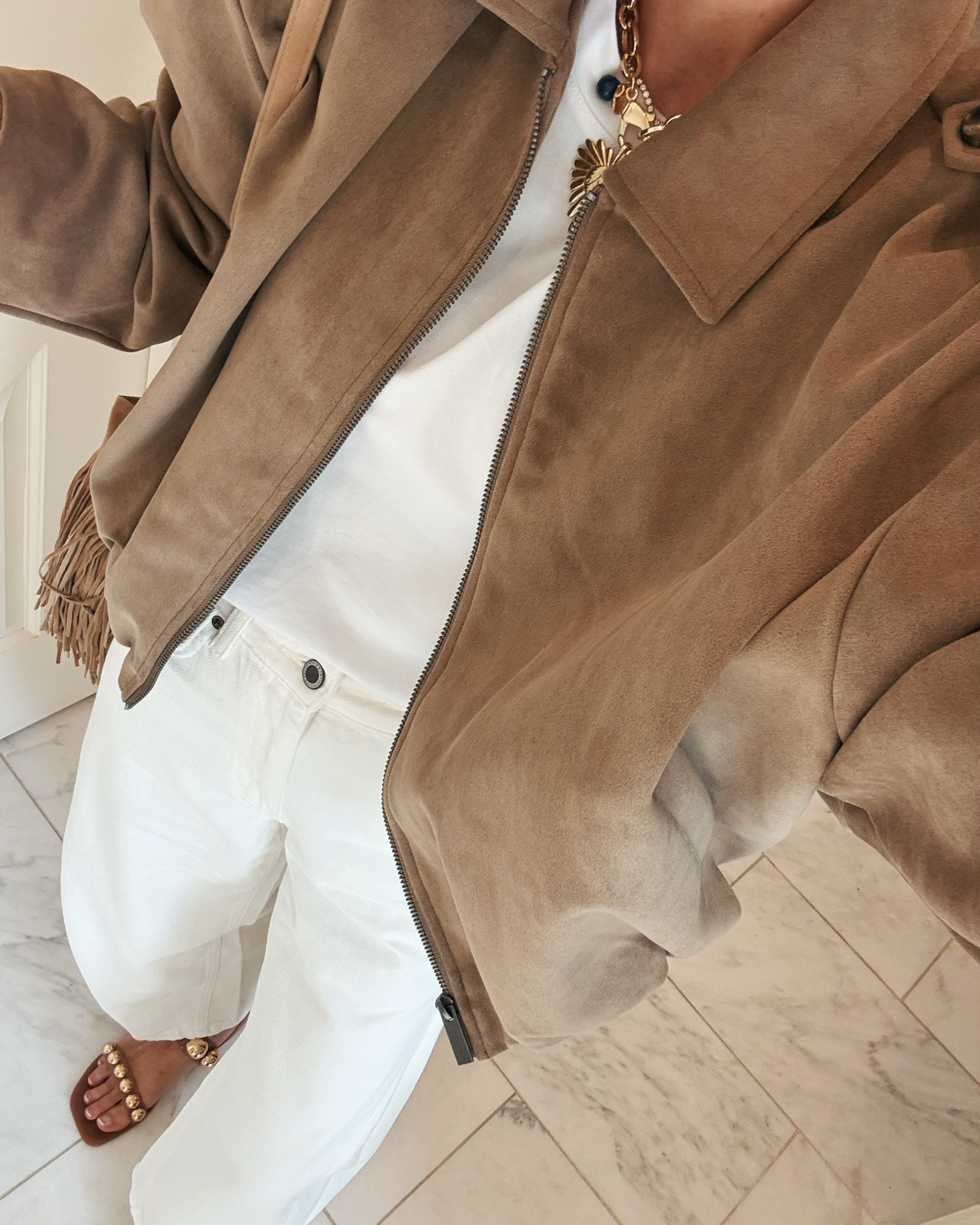 I'm wearing size small in this jacket, small in my $10 t-shirt and 2 in my Zara jeans. All fit tts
