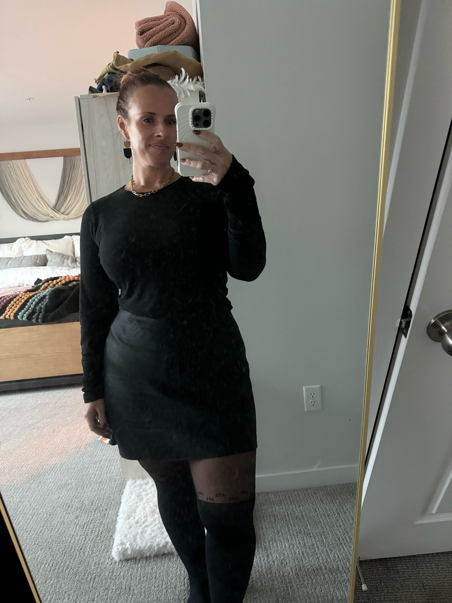 I am positively obsessed with this sleek, chic outfit. My thighs have always been too thick for thigh-highs. I wind up looking like a sausage stuffed into a too-small casing. These tights from From Rachel are a sexy, playful response to thigh-highs without the sausage casing effect. The washable silk skirt paired with a contrasting cotton fabric adds dimension while staying monochromatic and chic  

#LTKOver40 #LTKMidsize #LTKxMadewell