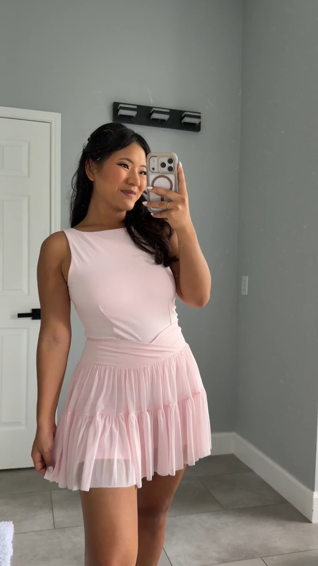 Blogilates Women's Ballerina Skort wearing size medium. Blogilates Women's Boatneck Crisscross Tank Top wearing size large. Blogilates Women's Marshmallow Full Zip Hooded Sweatshirt wearing size medium. 