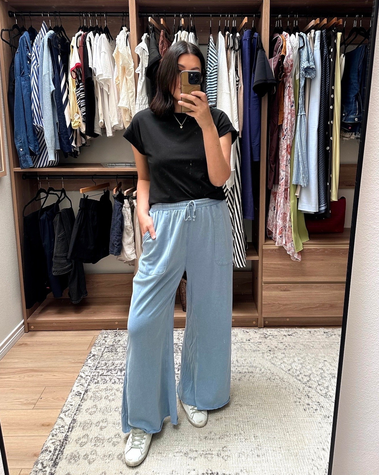 Let me talk you thru these two pieces! The top is just your general muscle tee but I find it more cap sleeve and I love it. I’ve been needing to expand my basics recently and this black tee fits perfectly (large for me).

okay love these pants! Yes they’re a sweatpants material but the color looks like denim so for me it’s a fancy sweatpants! Meaning I will wear these outside the house 😉 if you want a longer length, size up. These are the XL and they are big-ish on me but i love the length. Otherwise TTS.