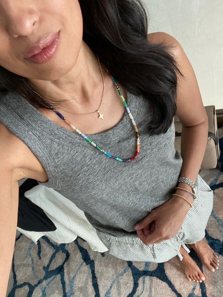 Casual dinner vacation outfit. Cruise outfit. Tank top is a staple. True to size. Pull on pants true to size, love the easy fit. Colorful beaded necklace is from @sequin use code NAOMI20 to save. Charm necklace from @mirandafrye use code HINTOFGLAM to save. Lip combo in shades Baby for lipstick and Taupe for gloss  

#LTKover40 #LTKtravel #LTKbeauty