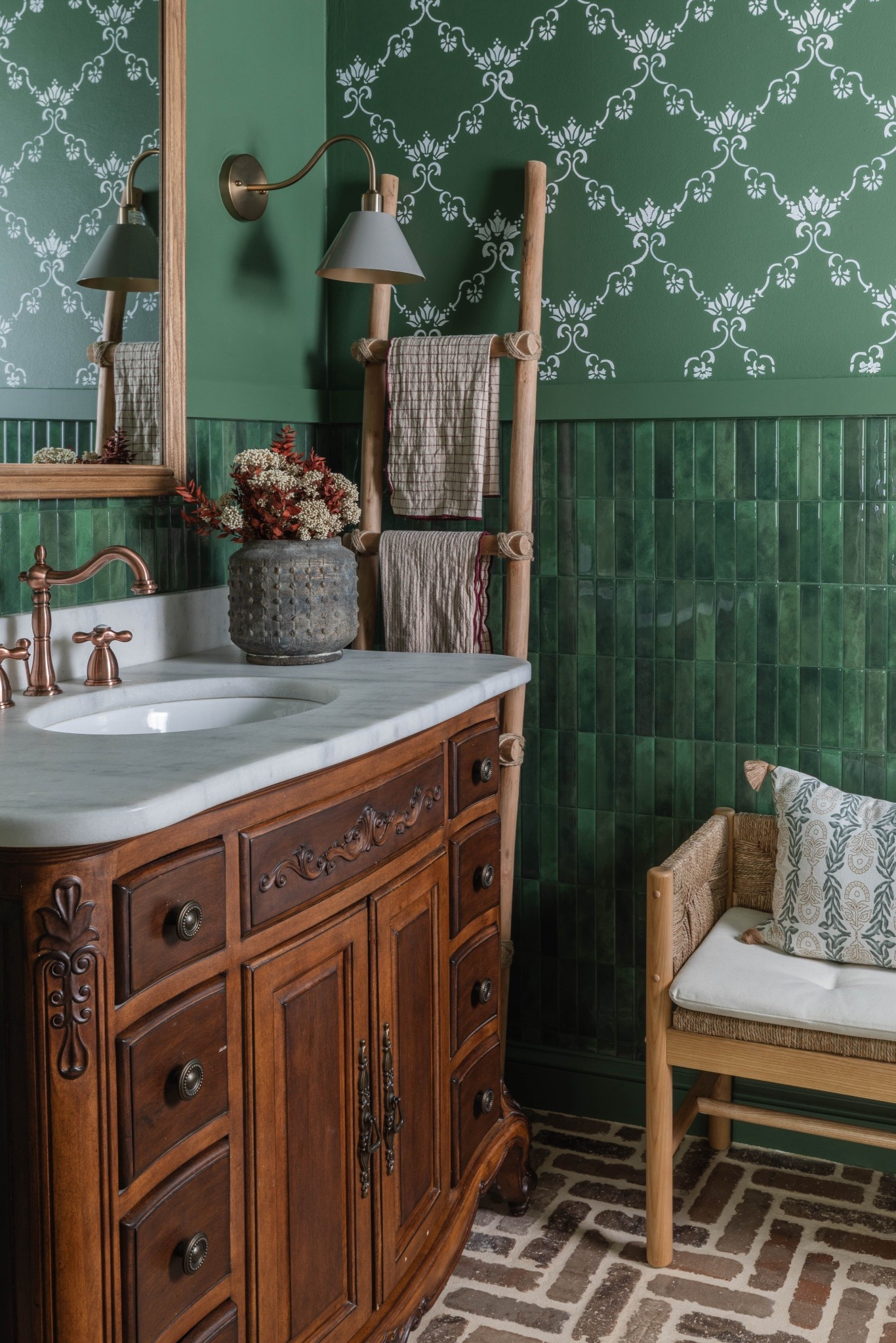 Green powder room 

#smarttiles #peelandstick #wallsconce #rattanbench #vase 

#LTKStyleTip #LTKHome #LTKFindsUnder100