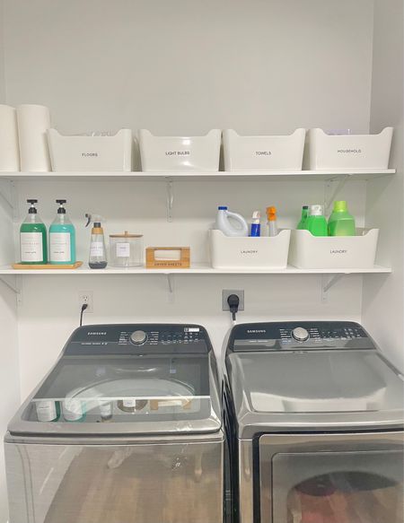 We love a blank slate and this project was no exception. This space had little storage so we created some by installing shelves. The decorative laundry decanters were just the icing on the cake!
