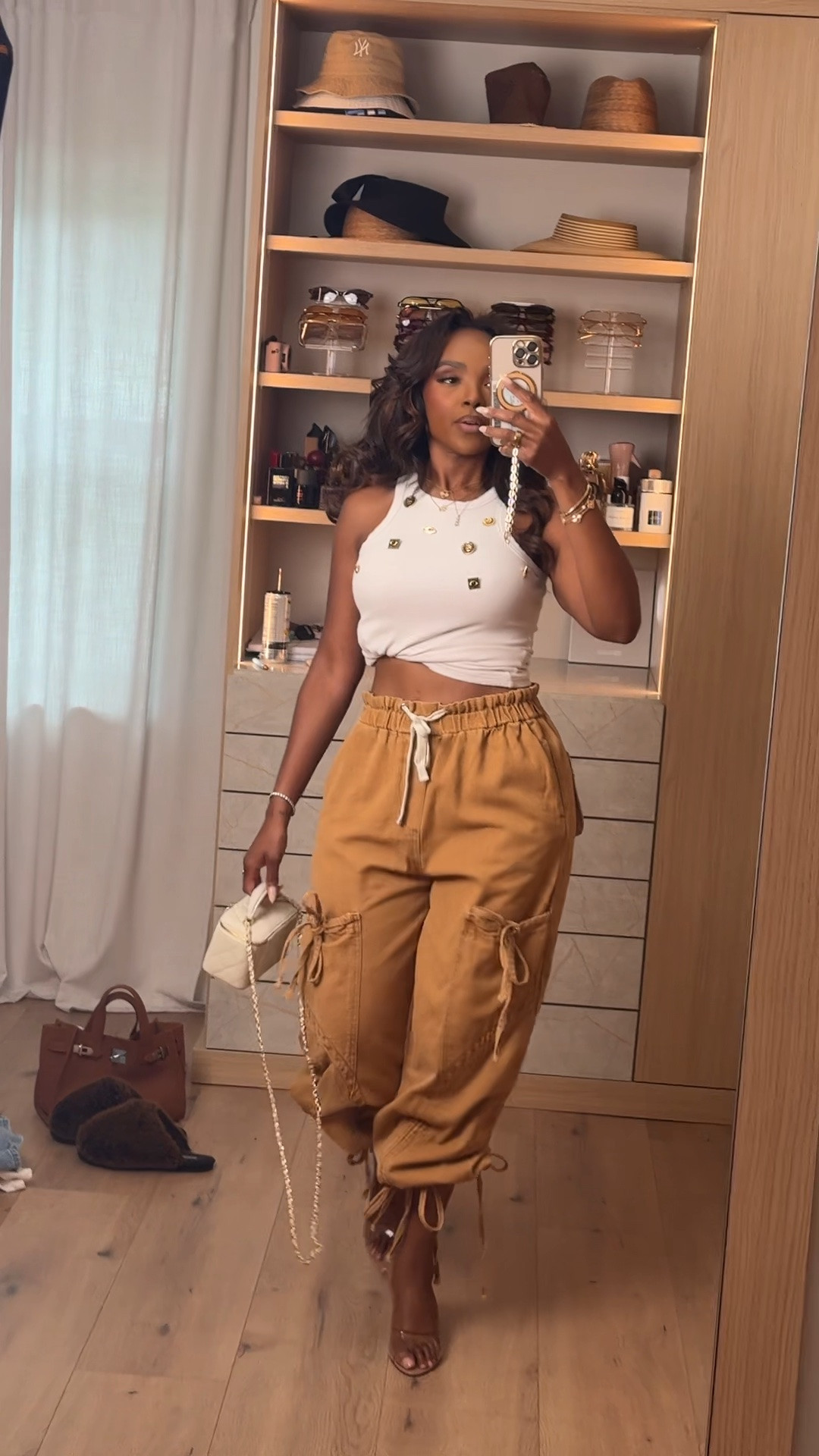 Hi Babes! 🤎✨

This is the perfect outfit when you want to be comfortable but still look put together. The cargo pants are lightweight with the cutest relaxed fit, and paired with a simple high-neck tank, it's an effortless look you'll reach for over and over.

✨ FIT DETAILS
• High-neck fitted tank
• Relaxed cargo jogger pants
• Adjustable drawstring waist
• Lightweight and comfortable
• True to size

✨ WHERE TO WEAR THIS
• Running errands
• Weekend outings
• Casual lunch dates
• Travel days
• School drop-off & pickup

The kind of outfit that looks elevated without trying too hard.

Everything is linked below!

xx Kira | IG: KirasFashionFinds

Measurements: 5'4" | 140 lbs | Size Small

https://liketk.it/6gk6X