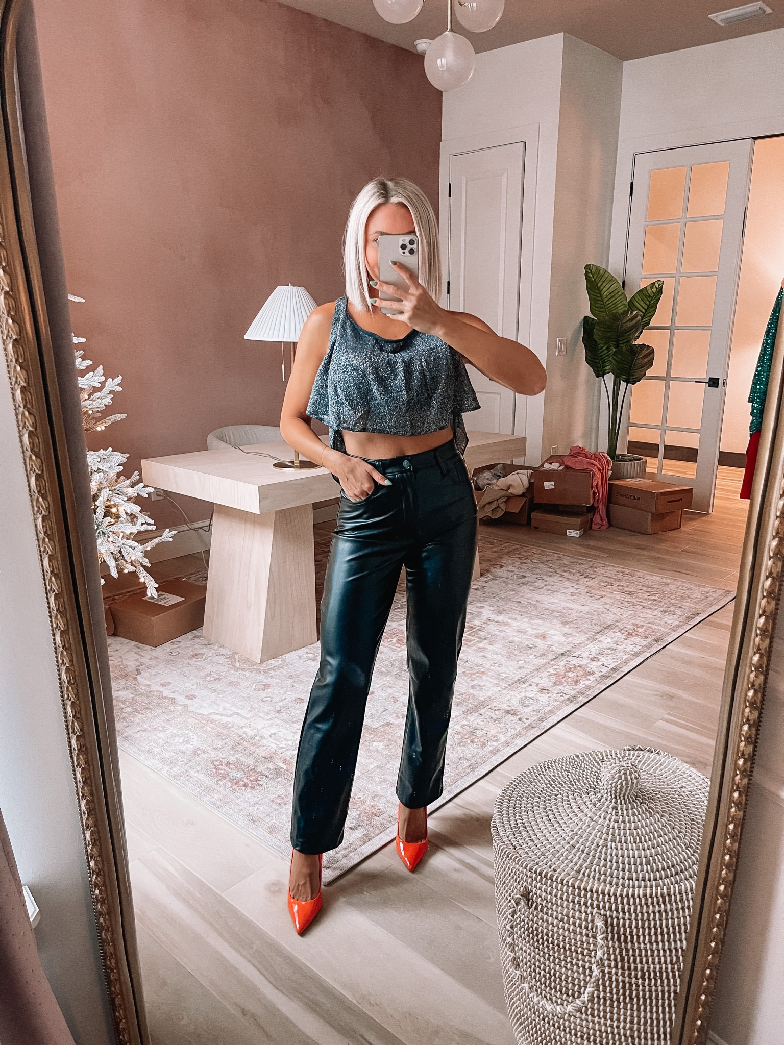 You should see the back of this free people sparkle tank! You need a black bra lette under this sheet top! Wearing an Xs! My pants are on sale and are size 26 

#LTKunder100 #LTKHoliday #LTKSeasonal