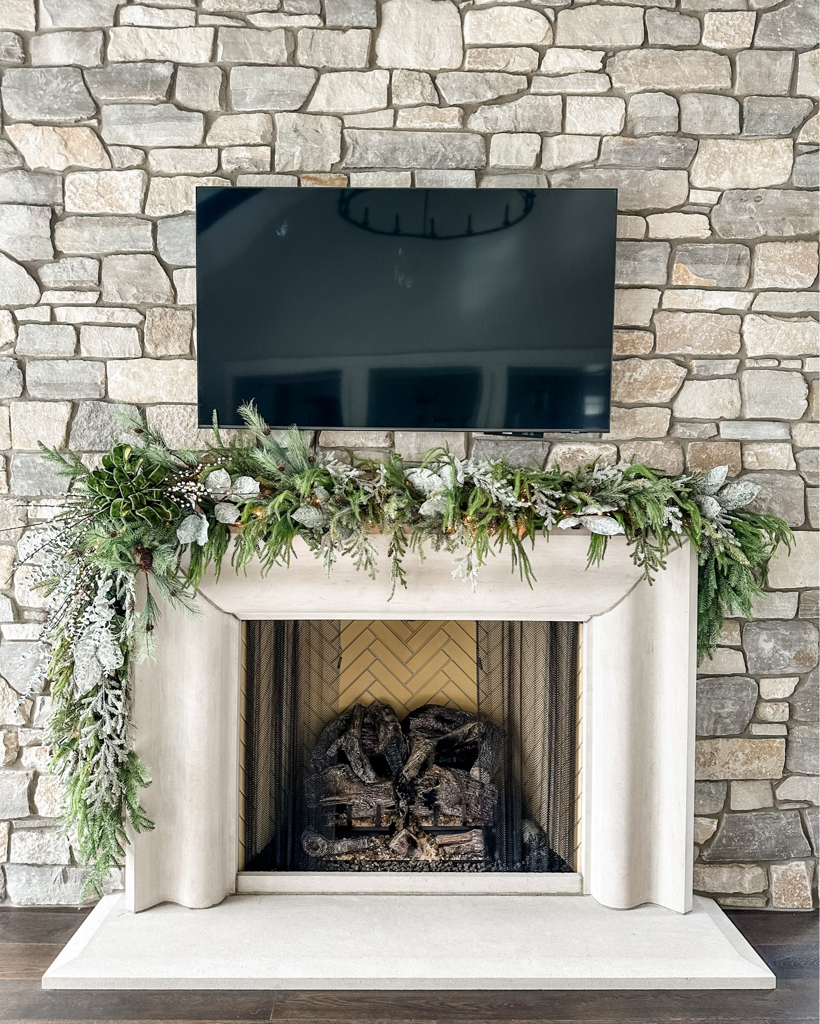 “A Winter Woodland Dream” Garland 🎄 

Bring timeless elegance to your hearth with a lush, nature-inspired garland. Designed with cascading layers of frosted cedar, pine, and eucalyptus, it captures the serene beauty of a snowy forest. Accented with glistening white berries, pinecones, and a statement velvet bow in forest green, this piece adds both texture and warmth to a stone fireplace backdrop.

Soft twinkle lights woven throughout give a gentle glow—perfect for cozy evenings by the fire. Whether styled for the holidays or simply to embrace winter’s charm, this garland blends organic luxury with natural grace.

#WinterDecor #HolidayStyling #FireplaceDecor #GarlandGoals #SeasonalDesign #ElegantInteriors #HomeDecorInspiration #CozyHomeVibes #ChristmasMantel #FestiveTouches #ModernRustic #NeutralHolidayDecor #WinterWonderland #InteriorDesign #HomeForTheHolidays #DecorInspo


#LTKSeasonal #LTKHoliday #LTKHome