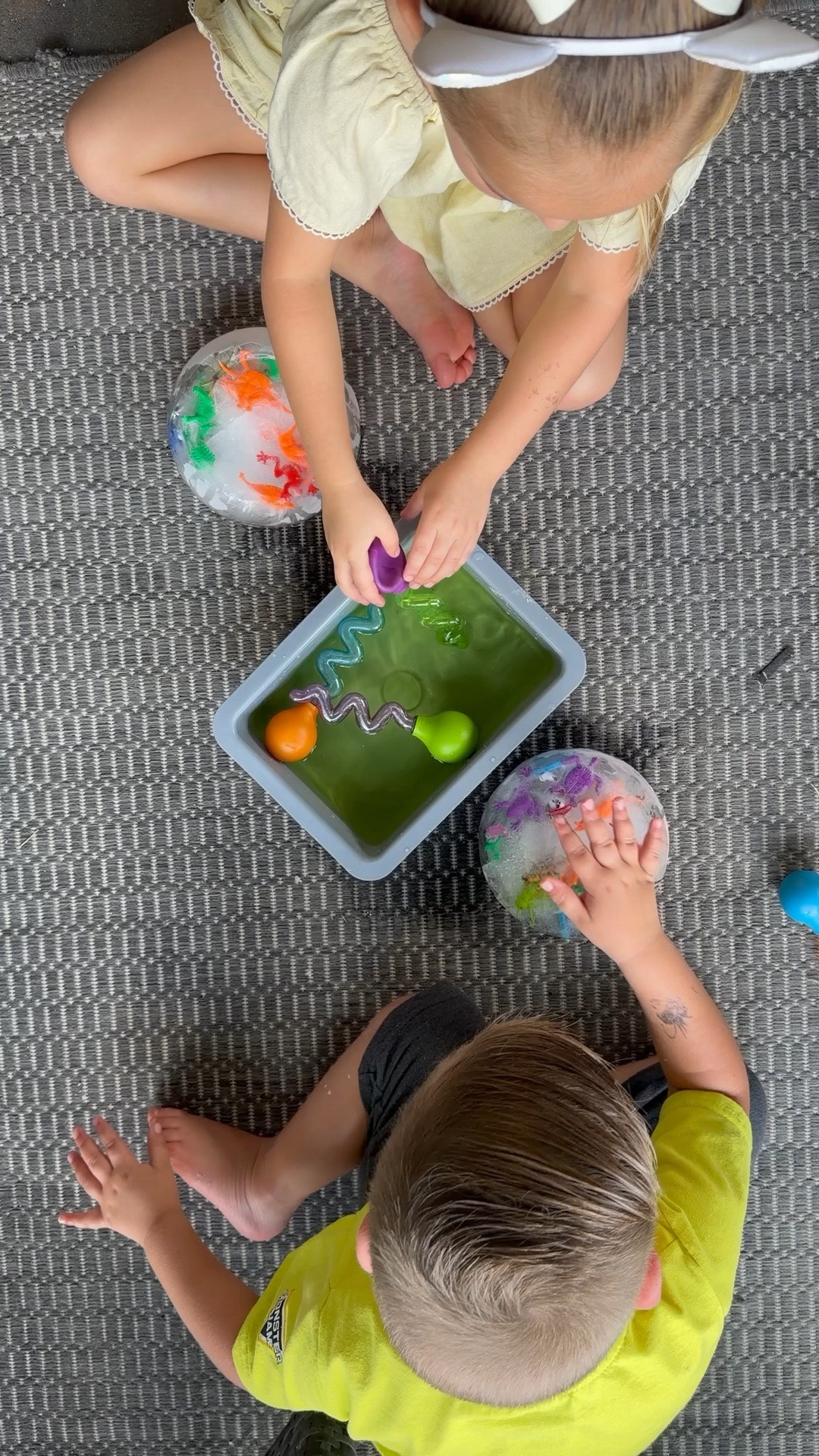 Summer outside fun! Possibilities are endless with this activity! Fill a container up with water, put in fun things freeze it and let them break it with water tools!