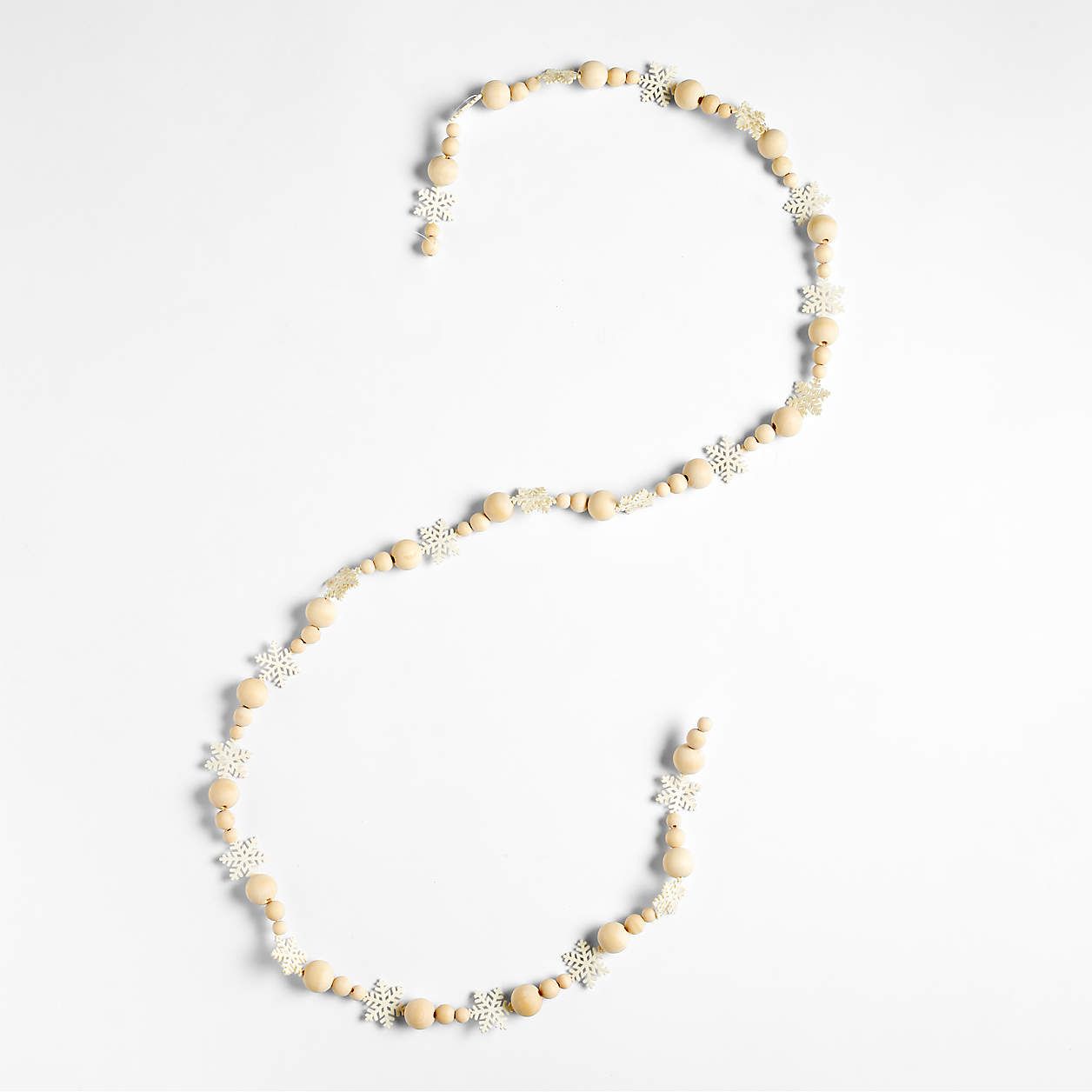 Snowflakes Wood Bead Garland 6' + Reviews | Crate & Barrel | Crate & Barrel