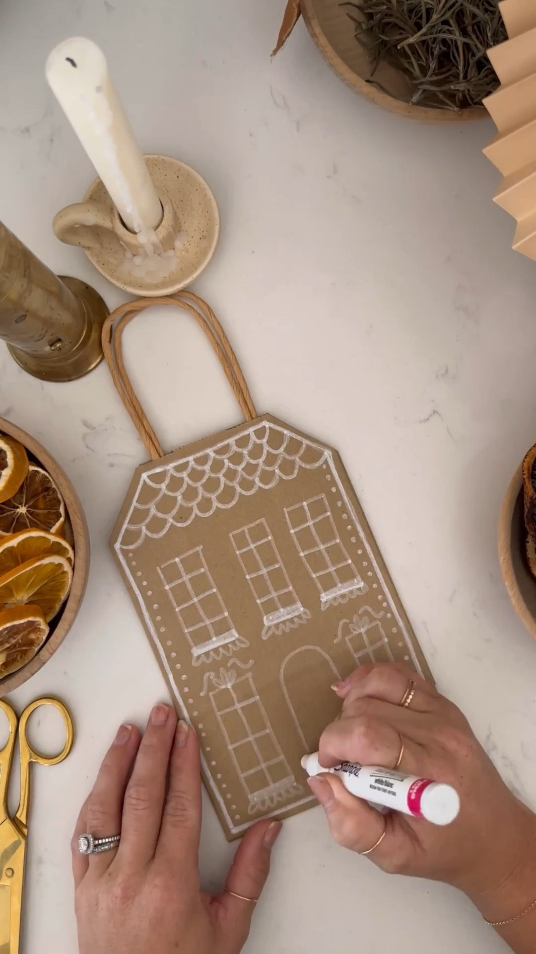 easy diy gingerbread house gift bags! All you need are kraft paper bags, white paint pens and a pair of scissors  

we use these for teacher gift bags and for neighbor gifts!

#LTKGiftGuide #LTKSeasonal #LTKHoliday

#LTKHoliday #LTKGiftGuide #LTKSeasonal