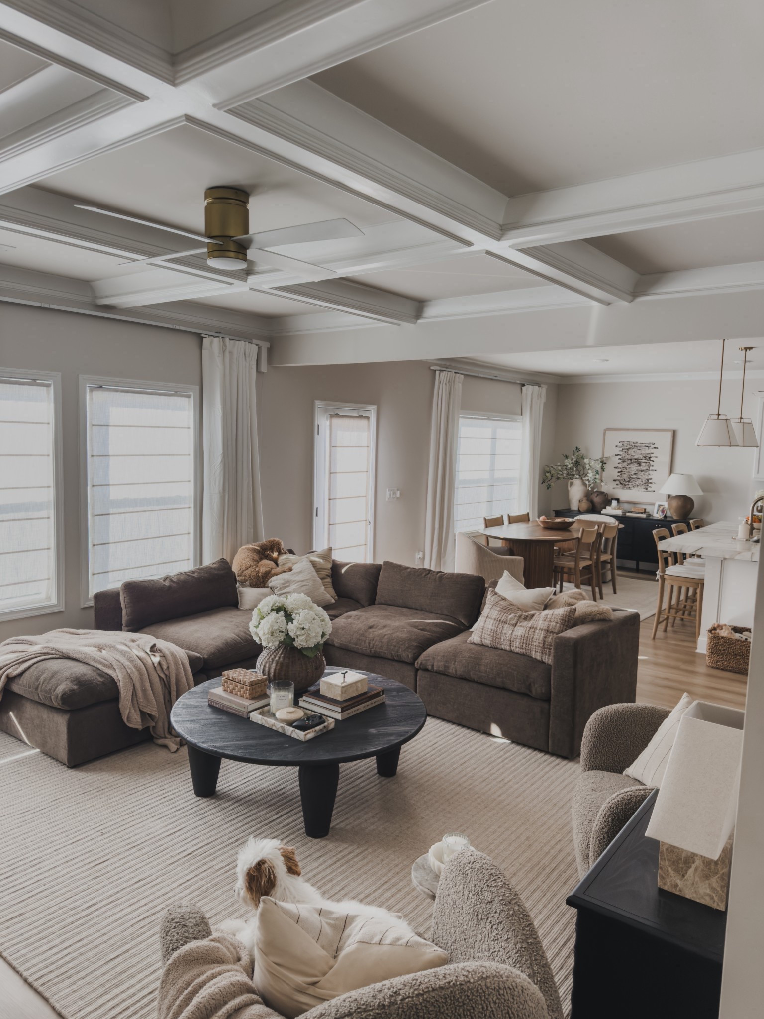 Sharing my early spring style in our open concept living area.

My modular sofa is currently set up as a sectional and it’s easily one of my favorite pieces in this space. The mocha brown color adds the perfect depth against all of the lighter tones, and I love how flexible it is depending on the layout. The storage ottoman is also perfect for tucking away extra blankets and pillows.

The 100% wool rug adds the prettiest texture and really grounds the room. Between that, the warm wood tones throughout the dining space and the linen textures layered in, everything feels cozy, balanced, and really livable.

This space is where we spend most of our time, so I always want it to feel calm, collected, and comfortable.

Sharing all of the details.

#LTKSaleAlert #LTKSpringSale #LTKHome