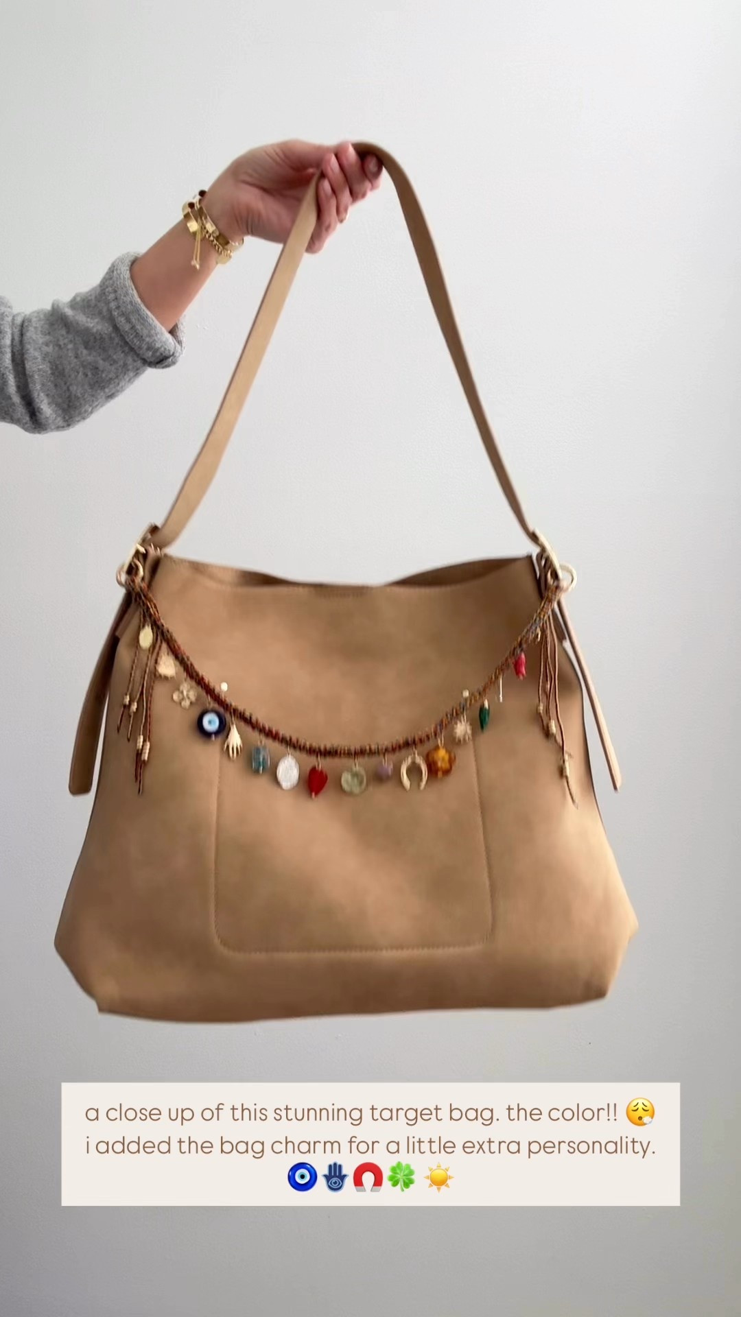 this. bag. is. from. target!! 
blown away. obsessed. and this bag charm adds a little something extra! 🪬