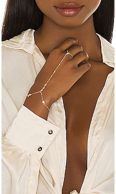 Lili Claspe Anais Hand Chain in Gold from Revolve.com | Revolve Clothing (Global)
