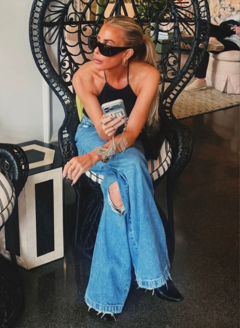 Tracy Tutor's  low-rise loose fit jeans that is meant to be worn relaxed and dropped. This pair features rigid denim in a vintage-inspired medium indigo wash, and it is finished with a 32" inseam, knee destruction, a clean-finished hem and classic five-pocket styling. For a looser fit, I recommend sizing up.