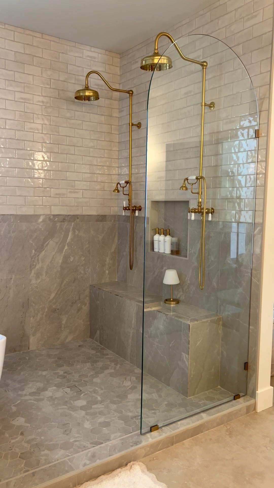 Primary bathroom links! 

Tile details:
Shower walls: Edward Martin Graham glossy 3x6 & Polished Blair 24x48 in Onciata Beige with coordinating bullnose trim

Shower floor: Edward Martin Blair 3x3 hexagon mosaic tile in onciata beige

Bathroom floor :  Edward Martin Leona 24x24 matte porcelain

#LTKHome
