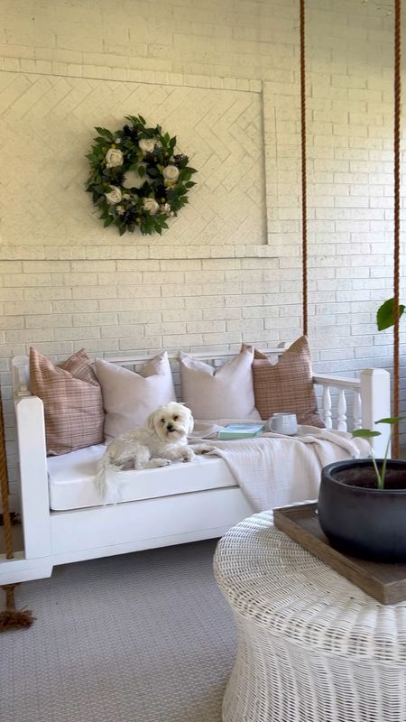 Sunroom, porch decor, sunroom decor, outdoor decor, swing porch bed, wreath, rattan coffee table, white can accent chair 

#LTKFind #LTKhome #LTKstyletip