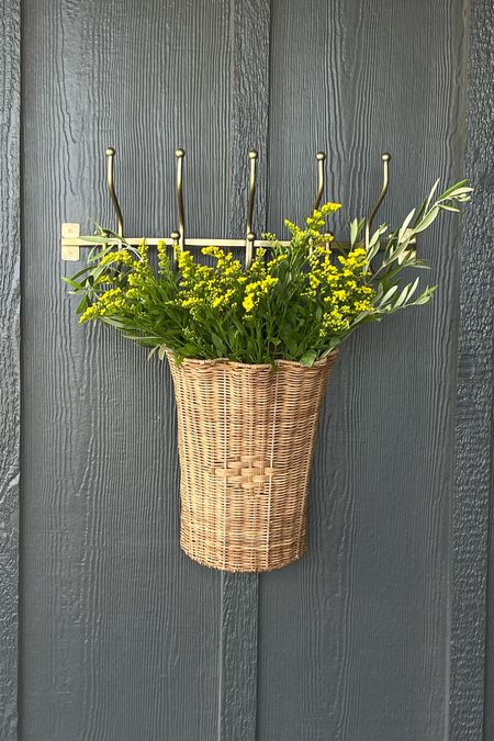 adding some cute touches in the backyard— I love this brass rack and the scalloped hanging basket 