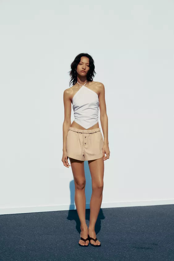 Mid-rise mini shorts. Elastic waistband with fold-over. Side pockets and back patch pockets. Butt... | Zara US