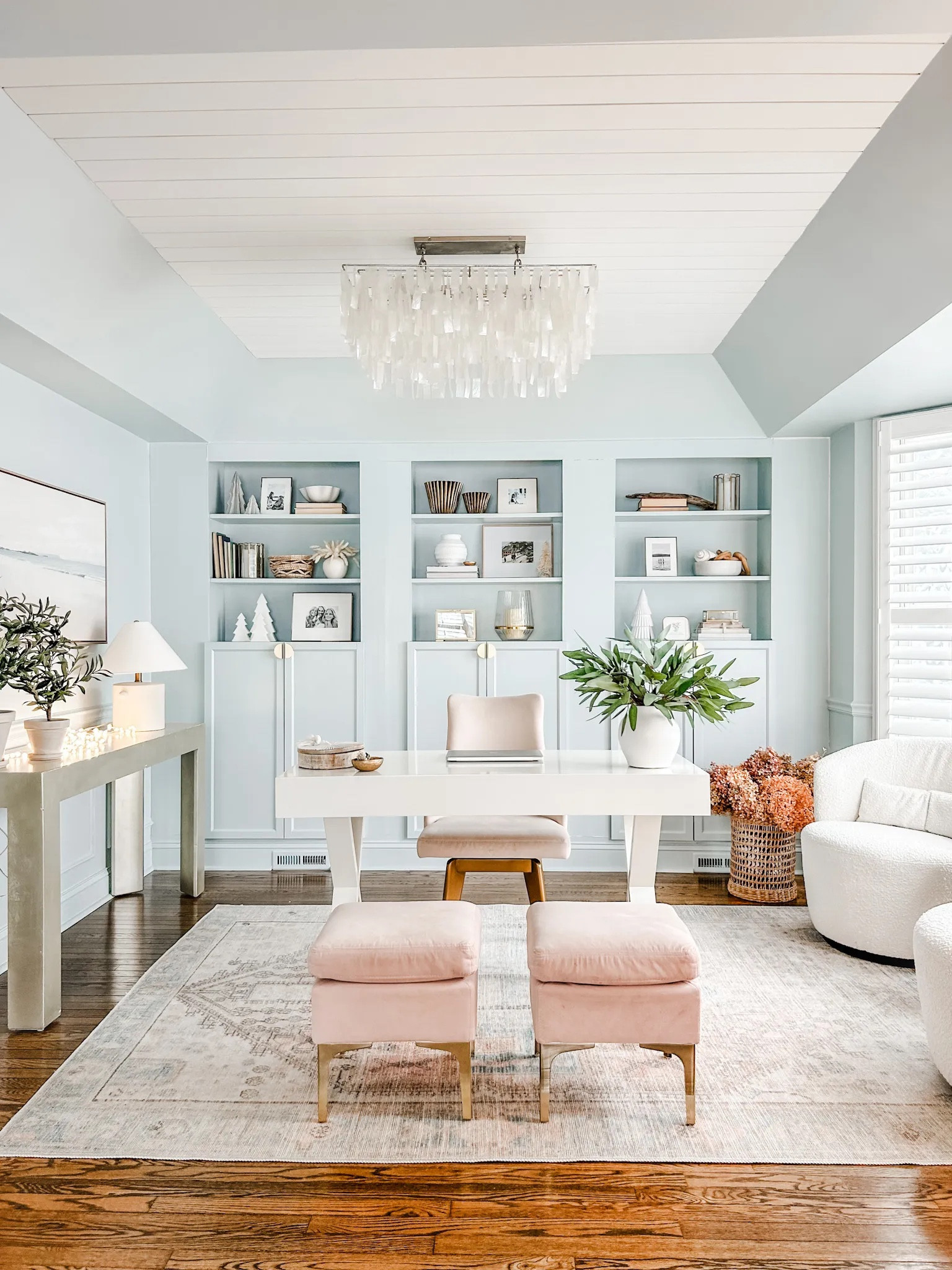Home office with blush accents and bouclé swivel chairs from Castlery!

Capiz chandelier, coastal chandelier, capiz shell chandelier, blush desk chair, blush velvet ottoman, artificial eucalyptus stems, faux green branch stems, white desk, home office decor, gold cabinet hardware, ceramic table lamp, Studio McGee lamp, desk decor, sea grass woven basket. 

#LTKstyletip #LTKhome #LTKMostLoved