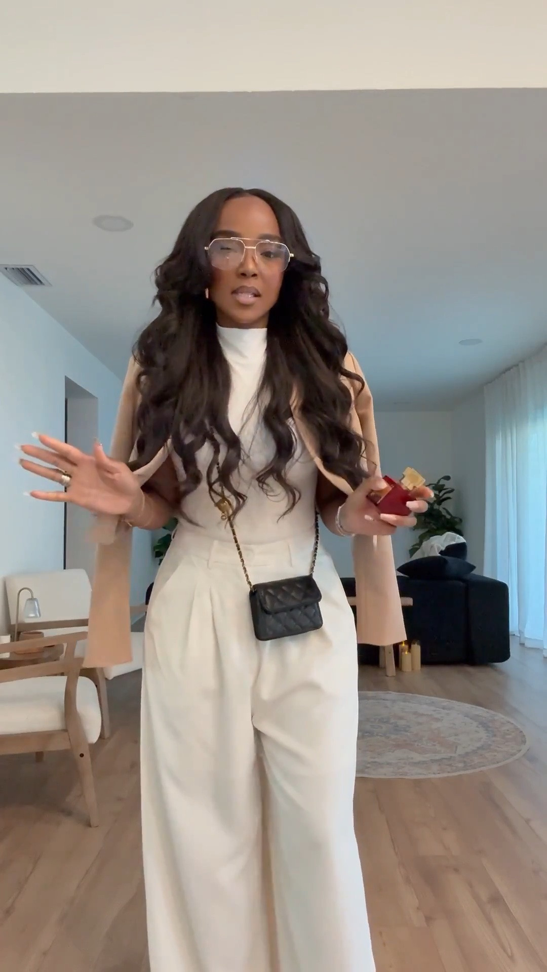 Hi Babes!

This is one of those outfits that looks designer without the designer price tag. The monochromatic cream base paired with the camel blazer draped over the shoulders gives instant old-money energy. The wide-leg trousers elongate the legs while the fitted mock-neck keeps everything polished and sophisticated.

If you're looking for an outfit that feels expensive, effortless, and timeless, this is exactly it. I love how the black mini bag adds contrast and makes the entire look feel even more elevated.

Where to wear this:
• Work meetings
• Lunch dates
• Business casual events
• Networking events
• Travel days
• Coffee runs
• Brunch with the girls
• Fall transition outfits

Undergarments: Nude seamless bra and nude seamless underwear to keep the cream tones looking smooth and polished.

Everything is linked below.

xx Kira | IG: KirasFashionFinds

34D - 27 - 40 • Size Small or 4

Follow me on Instagram and YouTube @kirasfashionfinds