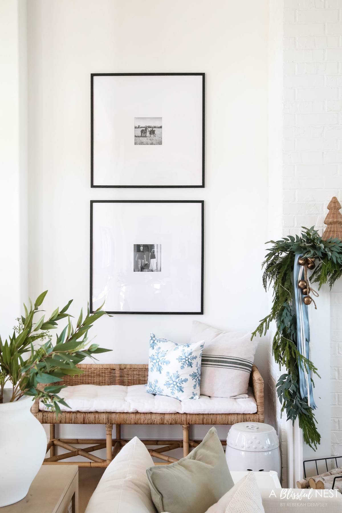 Neutral Christmas decor with just the right amount of holiday magic. Shop this look here
Norfolk pine Christmas garland, dusty blue satin ribbon, ivory velvet ribbon, vintage cluster cow bells on rope, fairy lights, snowflakes pillow, striped pillow, rattan bench 

 #LTKHoliday #LTKSeasonal #LTKHome