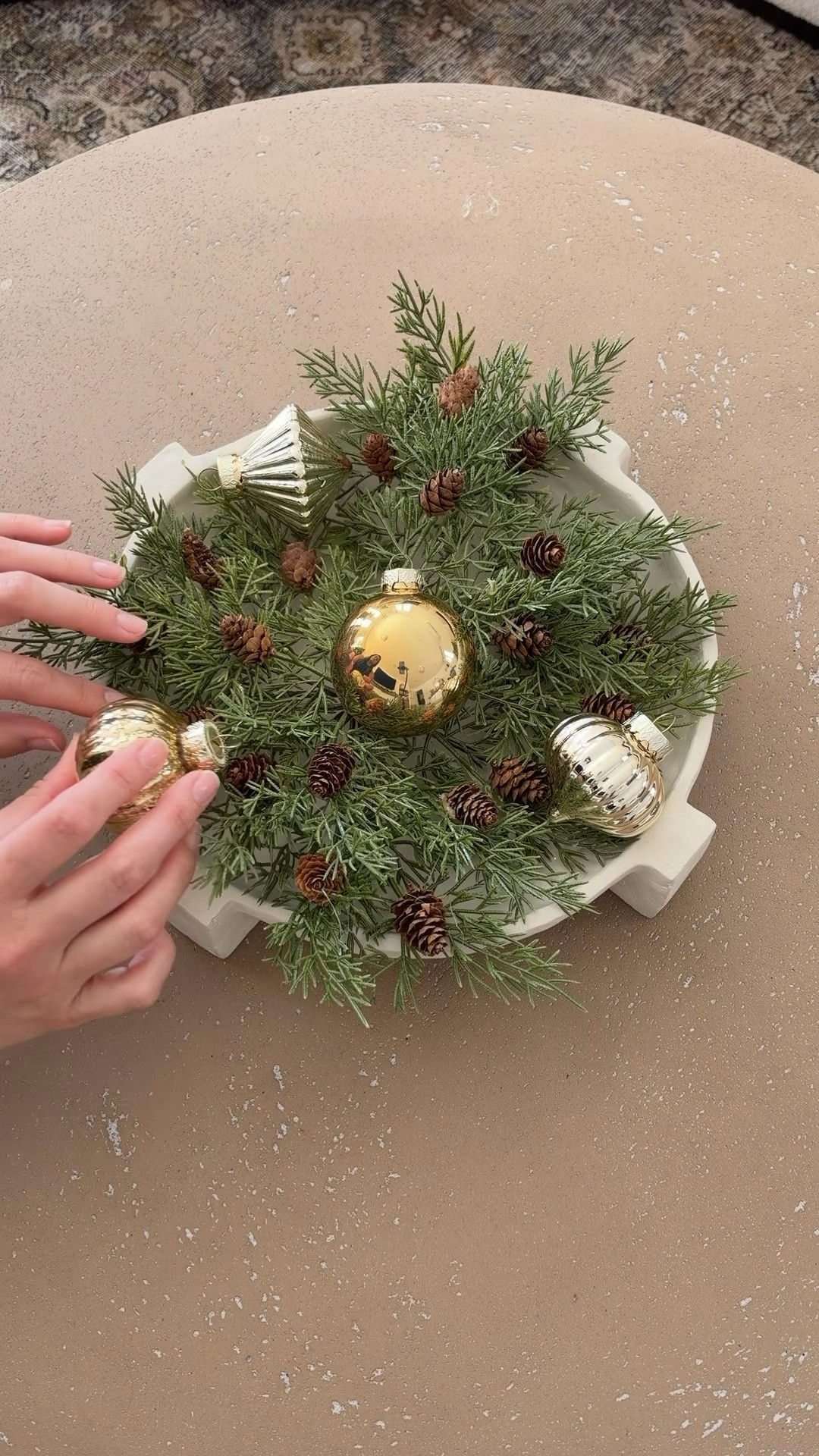 Here’s an easy coffee table Christmas decorating idea for your living room! Found these evergreen pine branches at Walmart and added some adorable ornaments! I love this affordable idea!