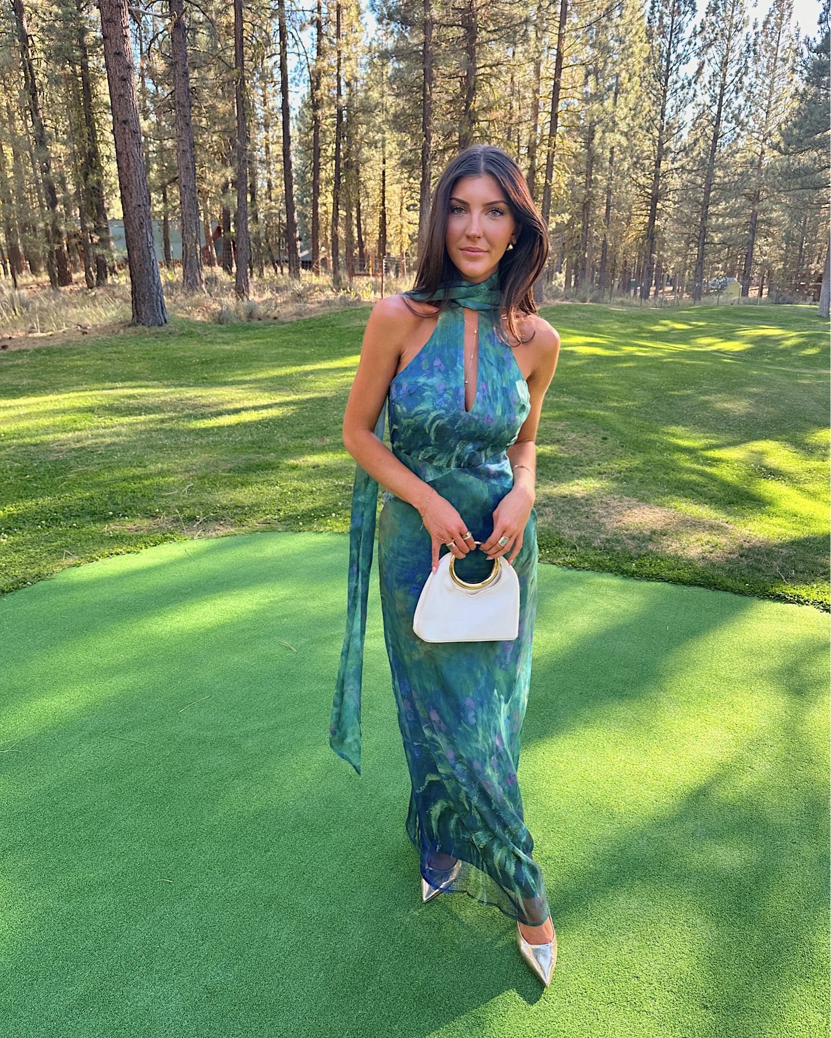 Wore this stunning green + blue halter gown by YLLW the Label to a wedding in the mountains of Lake Tahoe !! The flowy silhouette and watercolor print made it perfect for an outdoor ceremony surrounded by pines. Lightweight, flattering, and easy to style with a simple white clutch + strappy heels.

#LTKParties #LTKWedding #LTKSeasonal