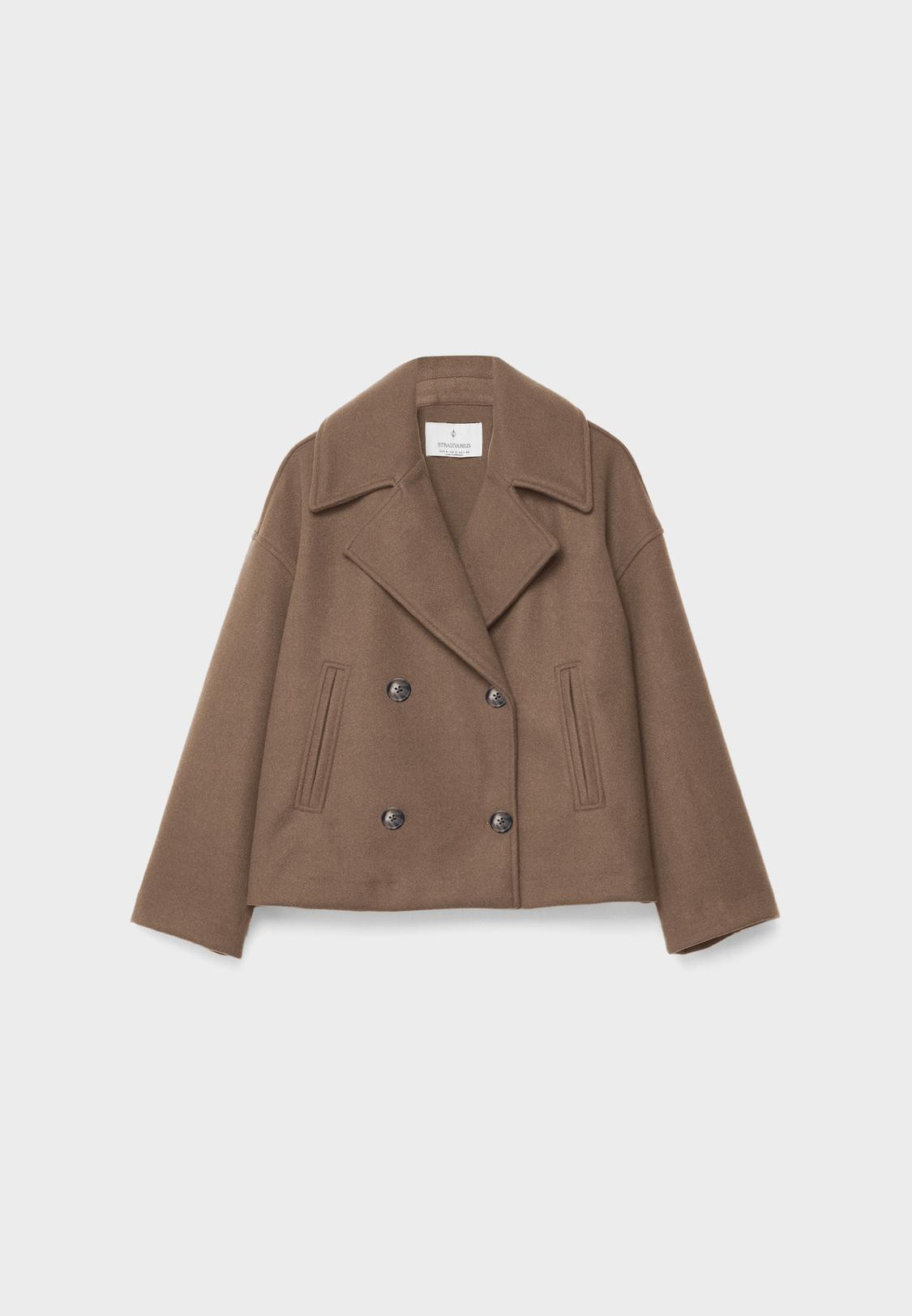 Cropped coat with a lapel collar and long sleeves. False front welt pockets. Double-breasted butt... | Stradivarius (UK)