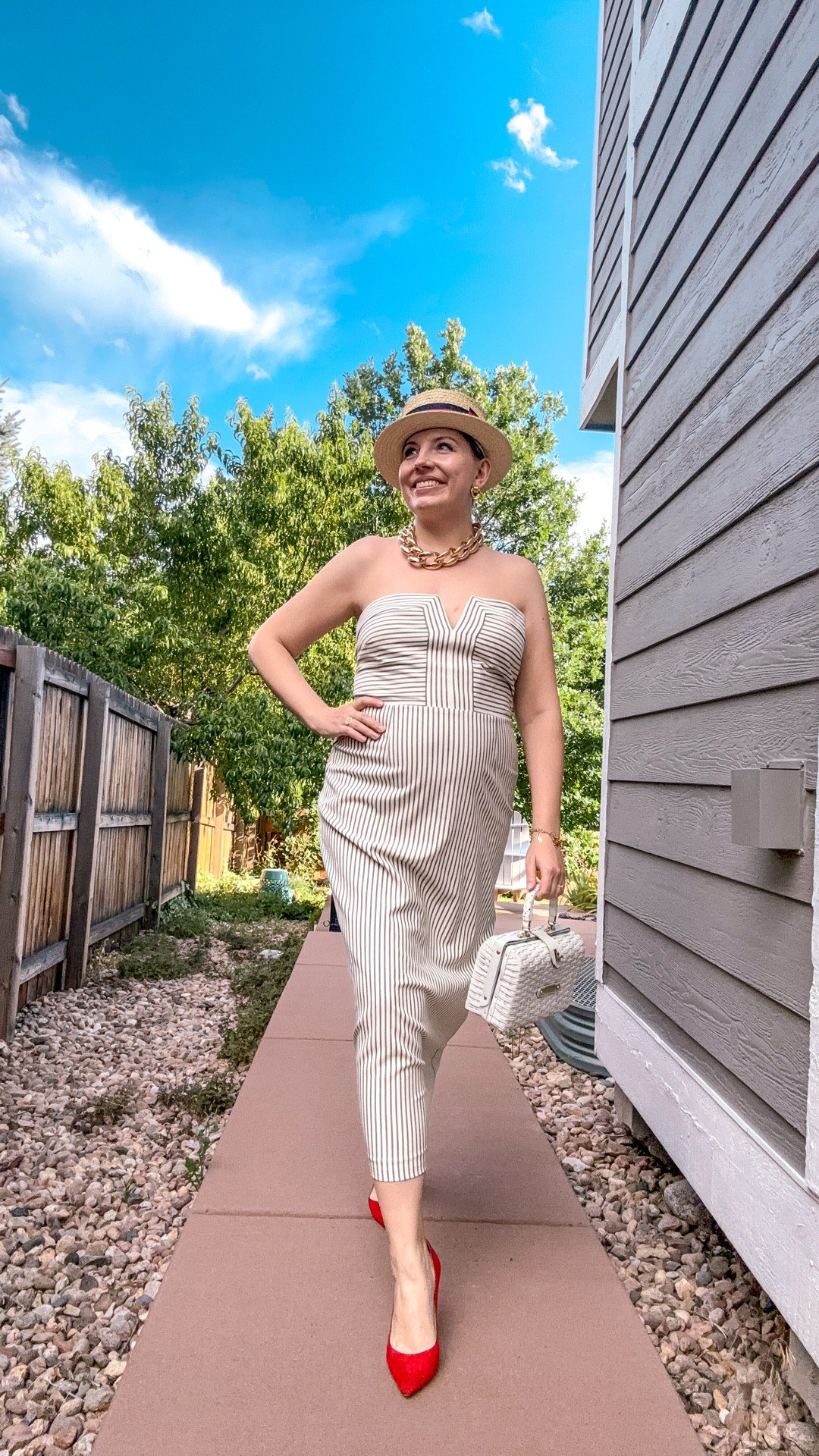 Look 19
Coastline Calling

This epic dress is serving vintage Riviera with a modern twist—topped off with a bold red heel, straw hat, and my go-to woven bag. Easy, elevated, and a little bit extra in all the right ways.

Part of Coastline Calling—my summer capsule of maximalist resortwear, vintage glam, and coastal charm (even if you’re nowhere near the water). Save this for outfit inspo and follow along for more seaside-inspired style.

Dress - Dillards (linked)
Heels - Jimmy Choo (current colors linked)
Hat - Scala (linked)
Necklace - Dillards (linked)
Bracelet - Talbots (similar linked)
Earrings - Dillards (linked)
Ring -Rocksbox (similar linked)
Fragrance - Dolce and Gabbana (linked)
Bag - Vintage (similar linked)

#CoastlineCalling #dillards #JimmyChooStyle #DillardsStyle #FoundAtDillards #JimmyChooShoes #SummerCapsuleWardrobe #MaximalistFashion #RetroResortwear #ModernPreppy #CoastalCool #NauticalInspired #PinstripeStyle #StraplessStyle #RedHeels #LTKStyle #StyledMyCloset #WovenBagTrend #StatementStyle #CapsuleWardrobeSeries

#LTKStyleTip #LTKItBag #LTKSeasonal