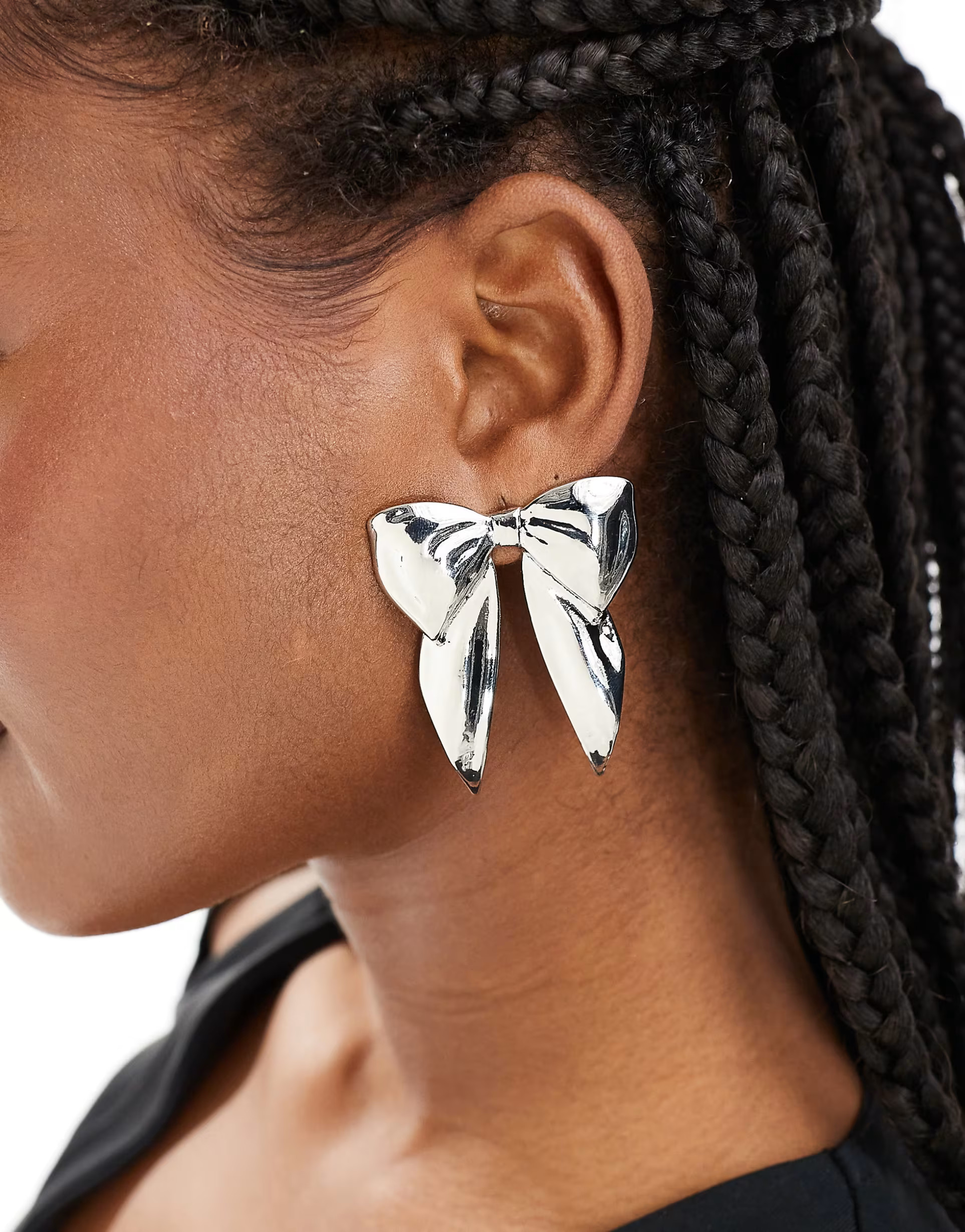 ASOS DESIGN stud earrings with wide bow design in silver tone | ASOS (Global)