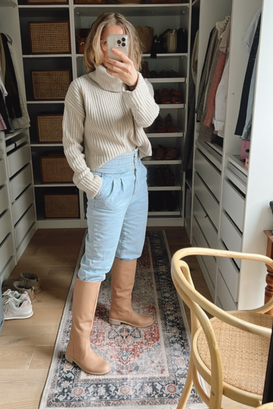 High waisted jeans, knee high boots and roll neck jumper 

#LTKunder100 #LTKSeasonal #LTKstyletip