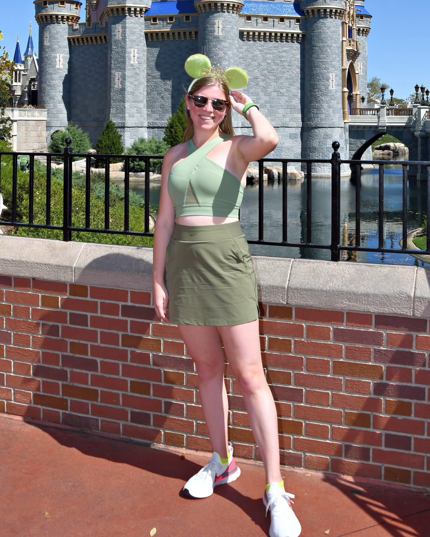 Olive, army, sage green workout outfit. Cross cross sports bra, and golf skirt  
