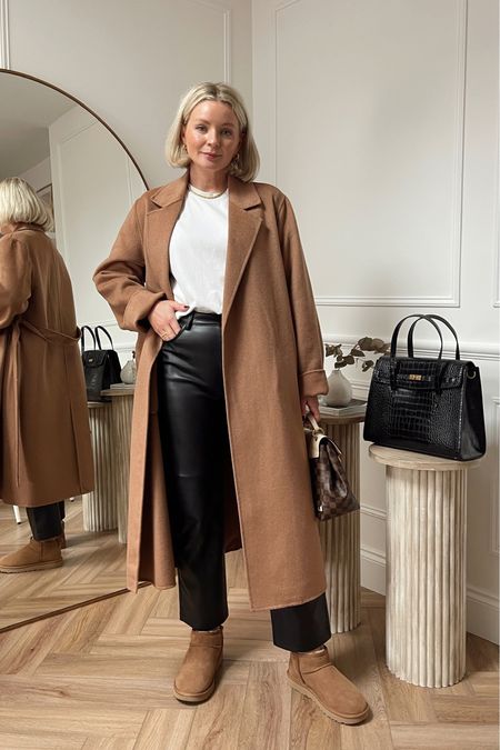 Styling leather trousers - comfy camel, white & black look. White t shirt from cos, camel belted coat from mango, Ugg ultra mini boots & black chic handbag from mango  

#LTKstyletip #LTKitbag #LTKshoecrush