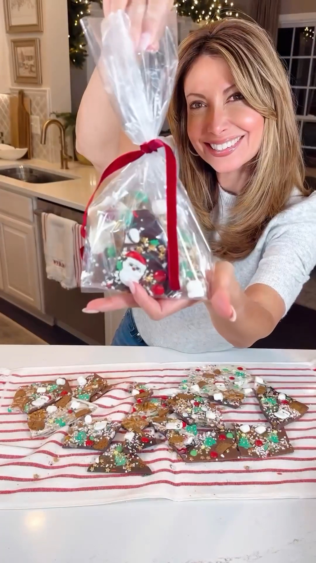 Spread holiday cheer with delicious homemade Christmas chocolate bark! 🎄🍫 Follow these simple steps to create delightful gifts for your loved ones.

Instructions:
-Lay out dark, milk, and white chocolate bars on a parchment-lined baking sheet. Preheat the oven to 100 degrees and let the chocolates gently melt for 5-10 minutes, laying the foundation for your delightful Christmas chocolate bark

-Once melted, use a fork or skewer to mix and marbleize the chocolates on the baking sheet.

-Sprinkle whatever toppings you enjoy!! I used crushed peppermint, candy, biscotti, marshmallows, pretzels and festive sprinkles over the marbled chocolate for a burst of holiday flavor.
		
-Create an extra magical touch by adding some edible gold glitter dust to your bark before your chocolate sets! 

-Chill the bark until completely set, then break it into festive shards.

-Package the delicious creations in decorative bags or boxes for a sweet and personalized Christmas treat!


#LTKHoliday #LTKGiftGuide #LTKkids