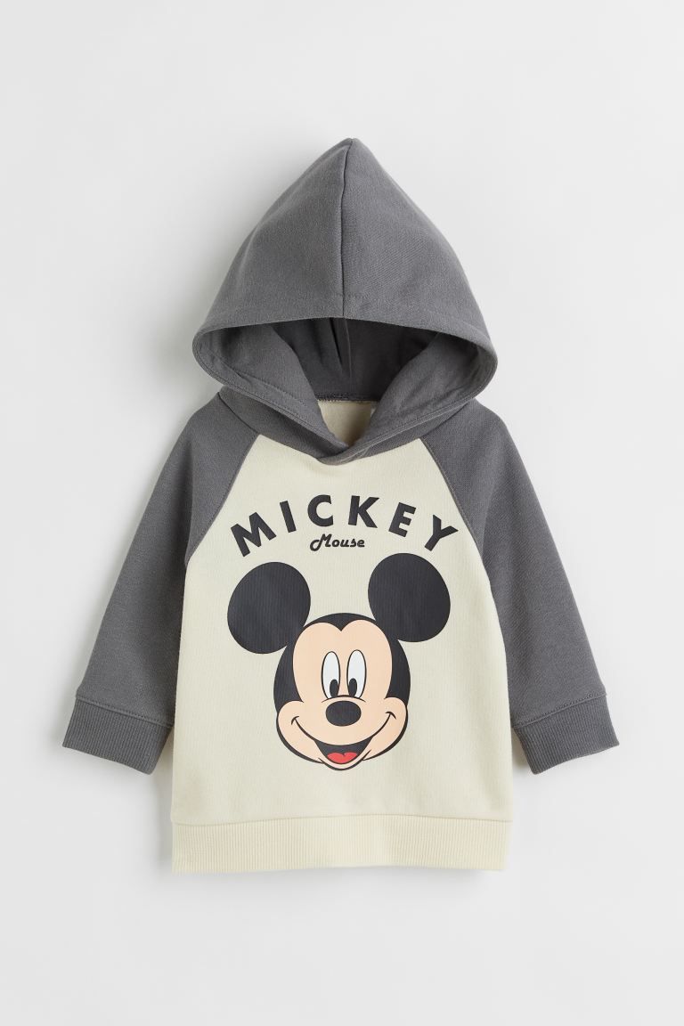 Sweatshirt hoodie with a printed motif and soft, brushed inside. Jersey-lined, wrap-front hood, l... | H&M (US + CA)