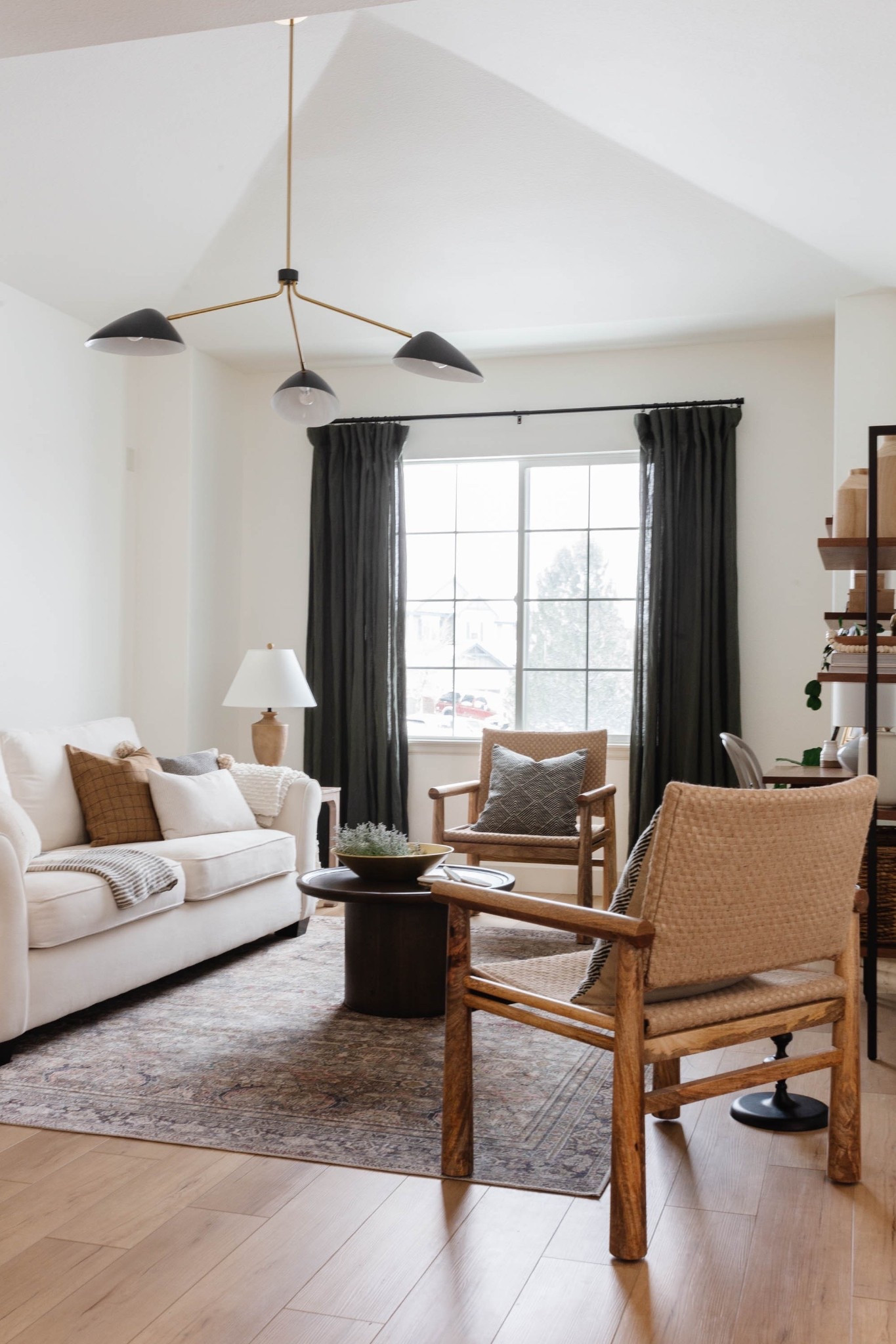 This front living room from #ProjectMeadowbrook had one big request: it needed to be both beautiful and incredibly functional. Our client wanted a space to relax and gather with guests—but also a quiet spot where the kids could do homework or an adult could take a Zoom call in peace. No small task, right?

To make it work, we carved out a workspace by the front window with a slim desk and comfy chair that blend seamlessly into the rest of the room. We layered in high-performance fabrics, a soft rug for playtime, and plenty of seating for hosting friends and family. Every detail was chosen to look elevated, but liveable.

If you're struggling with a space that needs to serve multiple functions, here’s your reminder: you don’t have to sacrifice style for practicality. Think dual-purpose furniture, unexpected layout tweaks, and mixing closed + open storage. A little creativity goes a long way!

Head to the blog to revisit the full reveal and see how we brought this room to life!

#LTKHome