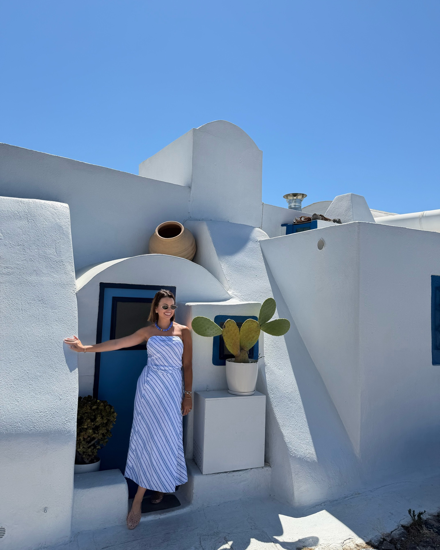 Santorini has lived rent-free in my mind since I was 16… and now I finally get why. 🇬🇷🤍

It really is as beautiful as everyone says.

I’m so glad I packed this blue striped matching set from @Target for this trip! It’s perfect. These jelly flats have also been a go-to this season! Very comfortable.