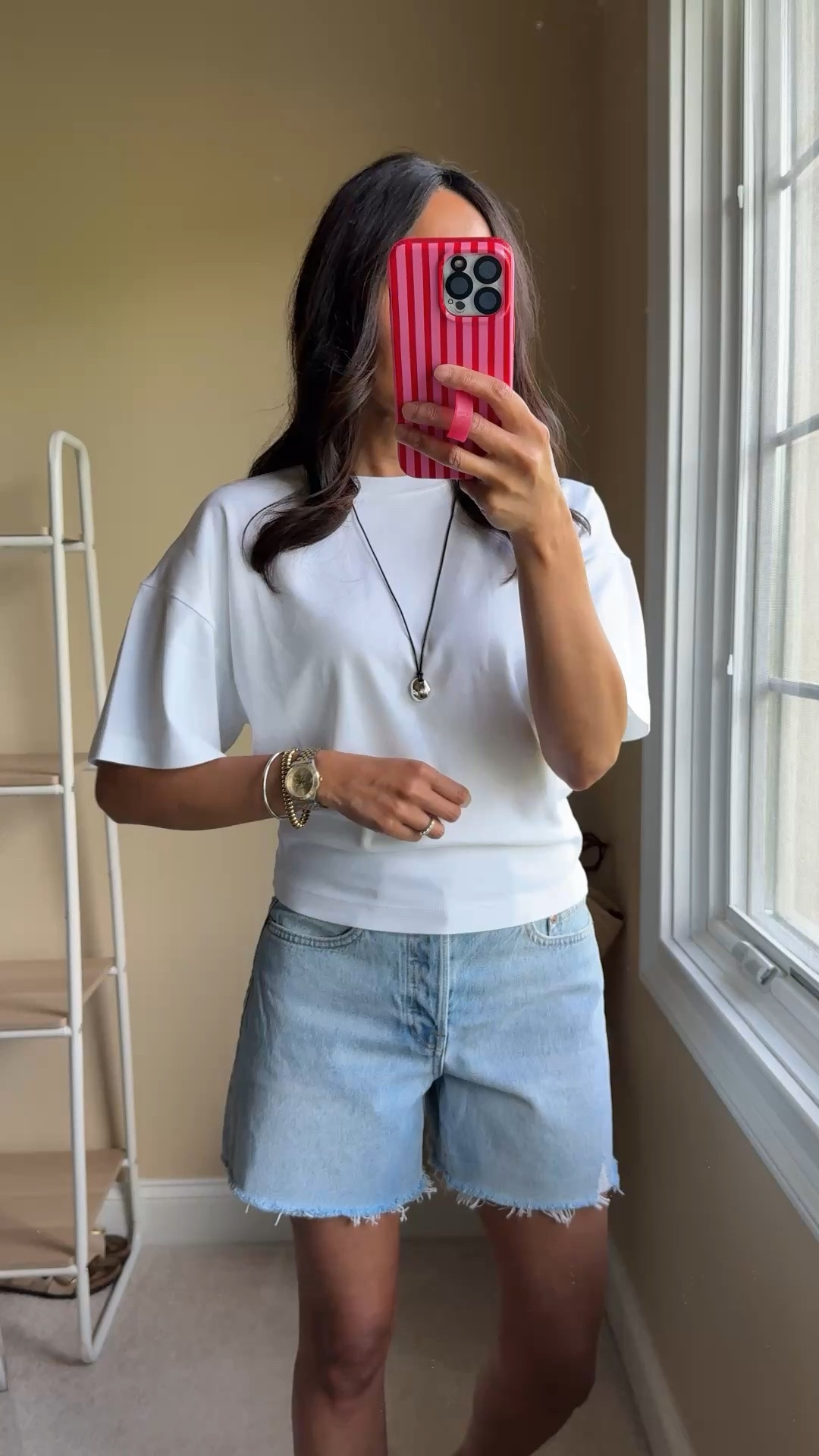 Summer outfit. My favorite type of pieces for summer outfits. 
Elevated t-shirt is all cotton. Linger flowy sleeves, looser through body but fitted and stretchy at waist. True to size. I shared the pink color in early spring and I loved it so much that I got the white. 
Denim shorts are also all cotton. Style reminds me of my favorite premium pair from agolde. I sized up. Multiple washes available. 
Embellished square toe Flip flops were a sale splurge from a while ago. I wear them as regular sandals with dressy casual outfits too. 
Sunglasses are a chic comfortable pair that look designer. Good quality. 
Pendant is my new favorite for summer. Trending sculptural design on black cord.  Adjustable. Perfect type of necklace if you wear basics or elevated basic tops to add interest to your outfit. Also comes in gold. 
Lip gloss is new to me this summer. Clean beauty lip oil in a watermelon shade that lasts and feels good on the lips. 
Nail polish is a glassy jelly look formula that is sheer and buildable. Fun and easy nails for summer. 
Straw tote bag is a classic style that works with everything.

#LTKootd #LTKOver40