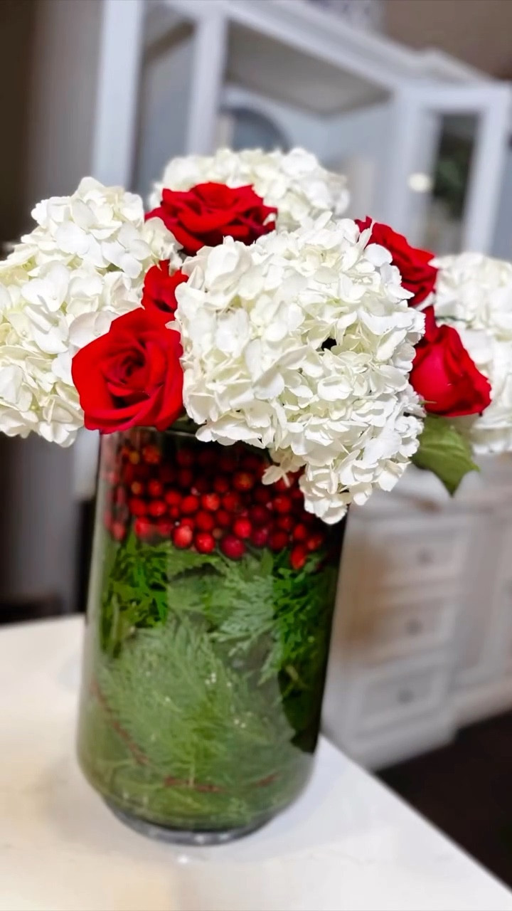 Elegant Holiday Floral Arrangement celebrates the season with a simple yet striking festive-themed floral centerpiece! ❤️ Embrace the holiday spirit and create your own masterpiece!

I added some real touch florals if guys like to recreate without using water and fresh florals for a longer lasting arrangement. 

Love this for a Christmas wedding centerpiece, holiday hostess gift or for your Christmas tablescape.  

#LTKHoliday #LTKHome #LTKSeasonal