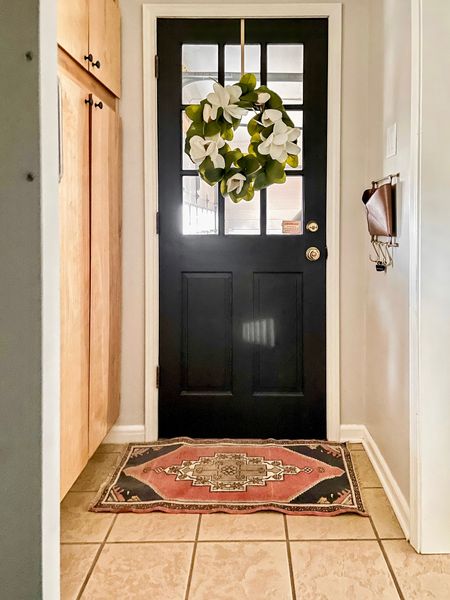 Garage entryway 
Magnolia door wreath 
Vintage rug
Black doors
Cabinet hardware 



#LTKstyletip #LTKhome #LTKfindsunder100