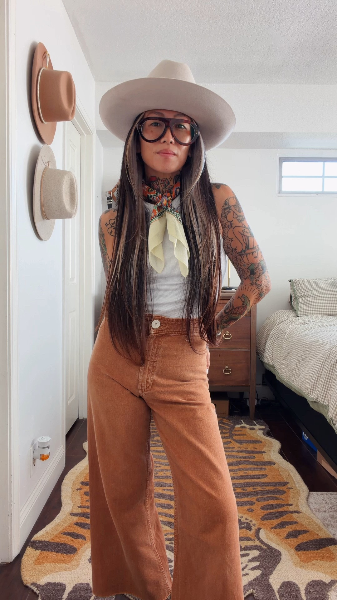 It’s Friday. Come on, let’s get dressed 🤎

Tank: snug tank @oldnavy 
Bottoms: the Marine @Zara  
Bandana: Goldie in Matyó floral @kambricgoods 
Rings: @americandecaychicago 
Boots: @pskaufman 
Watch: the Coda @bredastudio
Glasses: the Carlton in tort @efeglasses_official 
Hat: the Ezra @gigipip