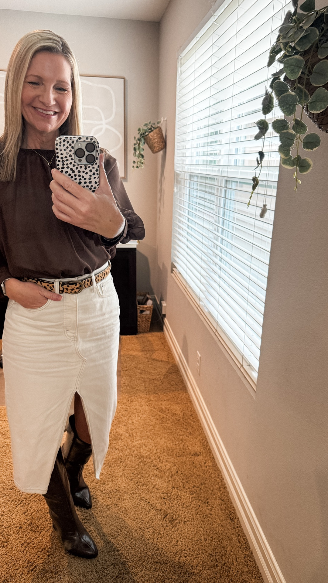 Dressed for success to kick off the first work week of 2026. Even though I work from home, dressing like I’m going to the office, especially on meeting days, helps me feel better prepared to take on the day. Although I will admit I have been known to be in slippers under my desk. 

My chiffon top is Old Navy and perfect for the office. My denim skirt is old from Abercrombie but I linked similar options. My leopard belt is Amazon and my boots are Target. 

#LTKOver40 #LTKootd #LTKWorkwear