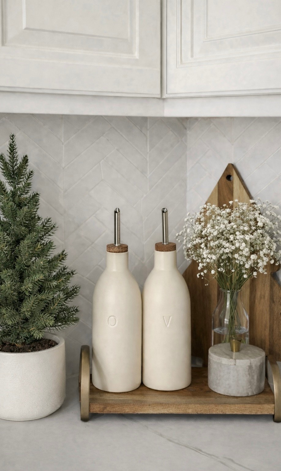 Minimal neutral kitchen decor featuring cream oil dispensers, wood cutting boards, and soft white florals. Shop this cozy kitchen styling below 🤍


#LTKSeasonal #LTKOver40 #LTKHome