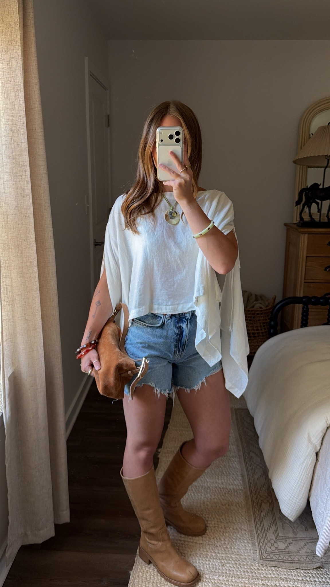 7/14/26 Casual Summer Outfit of the Day

One of my favorite summer outfits lately 🤍 I’ve been loving styling my Steve Madden boots with denim shorts—they’ve become just as much of a summer staple as they are for fall. I’m wearing Reformation denim shorts, a versatile Free People top that can be styled so many different ways, my Amazon earrings, Mango bangles, and my J.Crew suede bag to finish the look. Everything I can link is linked here ✨

#LTKootd #LTKSeasonal