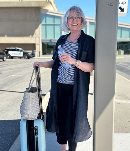 Layers keep me comfy when I fly.
Travel day in linen shirt dress over a striped tank and lantern pants. 
Wearing XS in Eileen Fisher dress 
Tank in m
Pants in small 
#traveloutfit what to wear to airport 

#LTKOver40 #LTKTravel #LTKStyleTip