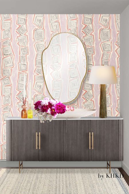 The design of this modern chic entry is inspired by this reeded sideboard. Reeded or ribbed detailing has gained the popularity in the last couple of years from kitchen cabinetry to bath vanities to sideboards and office desks. They add interest and architectural details to any space. The marble top over the sideboard and irregularly curved mirror bring in an organic touch to this entry, creating a sense of relaxation. The fluted bronze table lamp is simple yet sophisticated. The pink geometric wallpaper is playful. 
#4thofjulydeals #home #entry 

#LTKFind #LTKhome #LTKsalealert