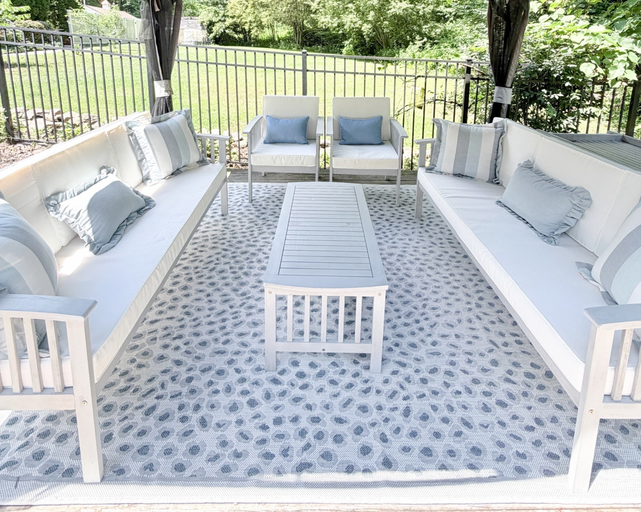 Outdoor living area refresh! Combined a five seat conversation set with an additional sofa to get a comfortable sitting area for 8 people, and tied it in with blue & white accents including an animal print outdoor rug & some amazing quality Sunbrella pillows, that are all on sale.

#LTKHome #LTKSaleAlert #LTKSeasonal