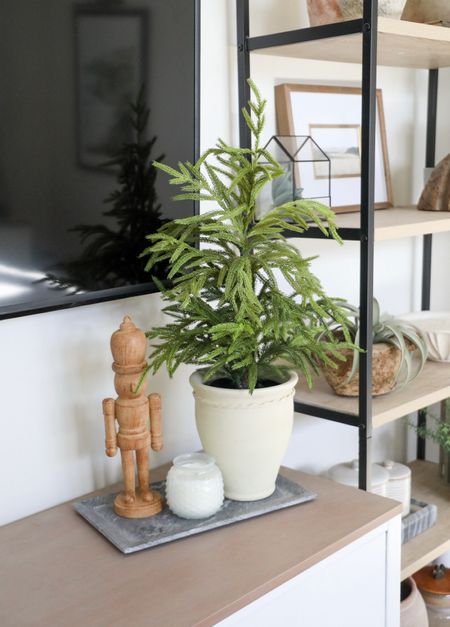 Easy holiday styling for a console, dresser, coffee table, or bench! To elevate the look of the tabletop tree, try using a planter from the spring that you’re not using or a utensil crock works too! #ltkhome #holidaydecor #christmas #christmasdecor #holidaydecorating #neutralchristmas 

#LTKhome #LTKHoliday